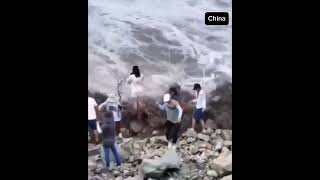 People trying to record the Qiantang River in China on video were swept away by floodwaters blog [upl. by Sikes688]