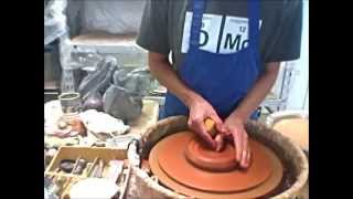 Pottery Helpsmoothing groggy red clay and making a mug [upl. by Rimidalg]