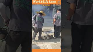 Two workers fumigate manholes with an industrial smoke generator to target pests in tunnels [upl. by Peterson]