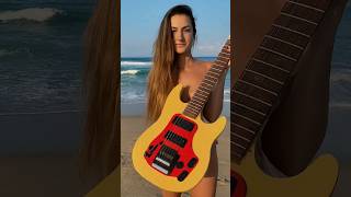 Beautiful women holding rare and bizarre guitar from around the world women heavymetal [upl. by Asirahc477]