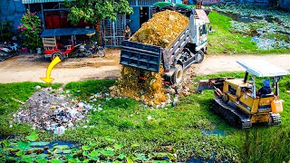 Start a New Project Landfill in flooded area by Bulldozer D20P KOMATSU amp Dump Truck Pushing Stone [upl. by Sayles]