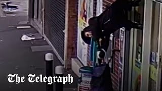 Shopper lifted 6ft into the air after jacket caught on opening shutters [upl. by Akeem407]