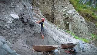 look at them collecting black sand from the cliffs and separating the black sand and rocks [upl. by Applegate]