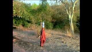 Maldhari woman with two water pitchers balanced on her head under the scorching heat [upl. by Einial]