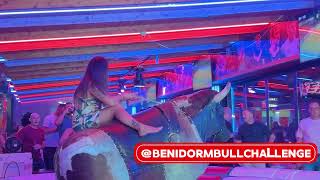 Brunette Girl in Colorful Dress Ride on Benidorm Mechanical Bull  Bull Riding 4K [upl. by Ainola]