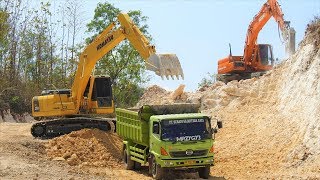 Excavator Dump Truck Digging Limestone On Road Construction Kobelco SK200 Komatsu PC200 [upl. by Tasia938]