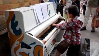 10 year old George Harliono playing street piano at a train station [upl. by Ardnaxila]