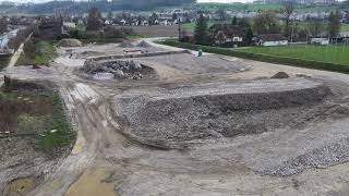 Wasserbau Baupiste entlang unter Sensesteg durch bis Mündung zum Materialaufbereitungsplatz [upl. by Burris407]