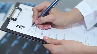 Doctor Filling A Medical Form Stock Video [upl. by Anyahc]