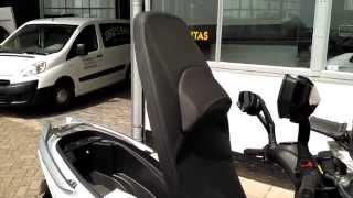 Opening the seat of a Kymco Xciting 400i [upl. by Ahsir192]