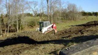 TakeuchiTL150 Skid Steer Moving mud [upl. by Aissirac]