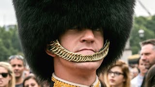 Why British Guards Wear Bearskin Hat Straps Below Their Lip [upl. by Novelc]