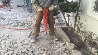 Jack Hammering Concrete With High Powered Air Jack Hammer [upl. by Jareen]