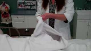 CNA Essential Skills  Making Occupied Bed 834 [upl. by Aliahs]