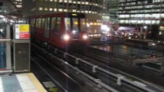 London  Docklands Light Railway train arriving at Heron Quays [upl. by Annayad]