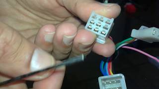 Removing pins from a male connector of automotive wiring harness [upl. by Letnom]