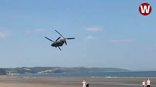 Moment lowflying Chinook helicopter thunders over Welsh beach [upl. by Melone230]