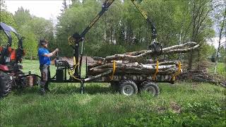 Small timber trailer in action Forstman FM40 [upl. by Ellmyer]