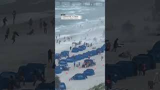 Waterspout tosses chairs and umbrellas on Florida beach  AccuWeather [upl. by Magnien]