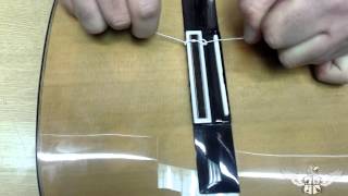 How to restring a nylon string classical guitar [upl. by Nylyak621]