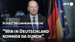 Scholz in Neujahrsansprache quotWir kommen da durchquot  AFP [upl. by Ayatnohs]