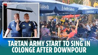 The Tartan Army start to sing in Cologne after earlier heavy rain downpour [upl. by Lanevuj]