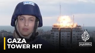 IsraelPalestine Conflict Tower hit behind Al Jazeera team [upl. by Laohcin]