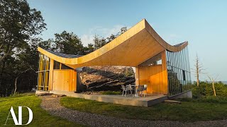 Inside a Family Home Built Around a 12000YearOld Boulder  Unique Spaces  Architectural Digest [upl. by Lepley]