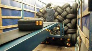 Telescopic conveyor unloading tires and cartons  LOADmaster [upl. by Shum]