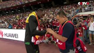 Usain Bolt Receives Gift from Cameraman Who Crashed into Him [upl. by Braunstein516]