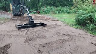 Volvo mini excavator with homemade grading beam [upl. by Ailimat]