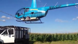 R44 ag spray Helicopter landing on a truck [upl. by Solorac809]