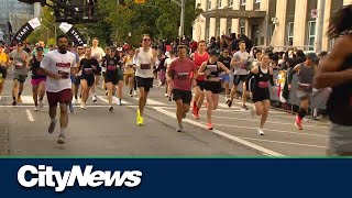 Runners take over the city for the Toronto Waterfront Marathon [upl. by Vig]