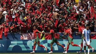 Morocco fans storm pitch against Argentina as Olympic soccer kicks off [upl. by Ecinnej]