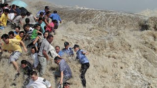 China wave shows its power Worlds largest tidal bore in Qiantang river 2023 [upl. by Octavla]