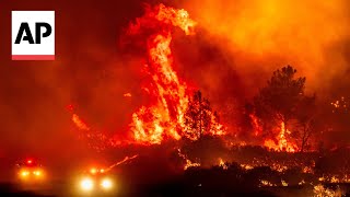 Californias largest wildfire explodes in size as fires rage across US West [upl. by Wymore]