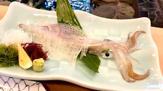 Eating super fresh squid swimming in a fish tank right in front of you in Japan [upl. by Ewall451]