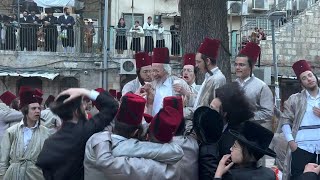 UltraOrthodox Jews celebrate Purim holiday in Jerusalem  AFP [upl. by Anaugal]