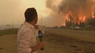 Caught on camera Fort McMurray fire erupts behind Global News reporter [upl. by Melanie]