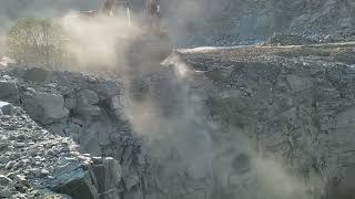 Watch the Sany SY350 Excavator Clearing Stone Quarry Face for Blast Holes [upl. by Akemed]