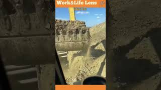 Excavator with arched bucket teeth digs compacted soil and rocks carving a trench for utilities [upl. by Ailhad]