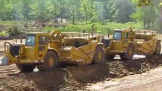 Living on the Edge  CAT Earthmovers excavating a pond  72211wmv [upl. by Denver212]