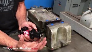 How to remove axle end caps using the Park Tool AV5 Axle Vise Tool [upl. by Bysshe766]