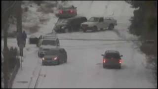 2010 USA Cars sliding and crashing down icy hill in the snow [upl. by Neitsabes249]