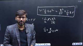 A capacitor is charged with a battery and energy stored is U After disconnecting battery another [upl. by Anelahs]