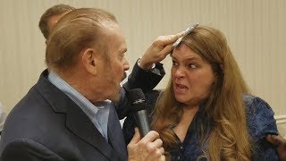 Exorcist Bob Larson ministers healing and deliverance to a woman with dozens of diseases [upl. by Anrapa752]