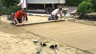 Screeding a paving laying course [upl. by Igal]