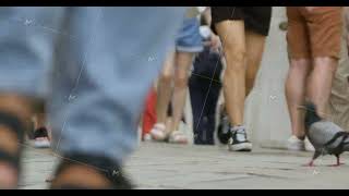 Ground level view of bustling street with diverse pedestrians and pigeon [upl. by Rhodes]