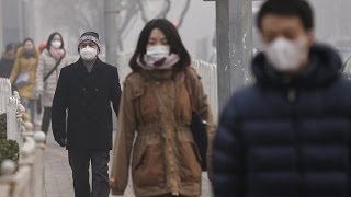 Smog shrouds Beijing with hazardous pollution levels [upl. by Jaffe868]