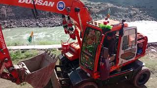 Exvwater machine is making road using stones at Neelam jehlum hydroelectric project noseri [upl. by Artur]